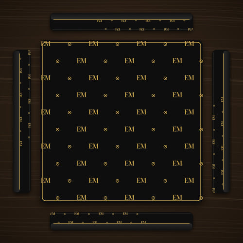 Four black and gold mahjong racks around a matching mat