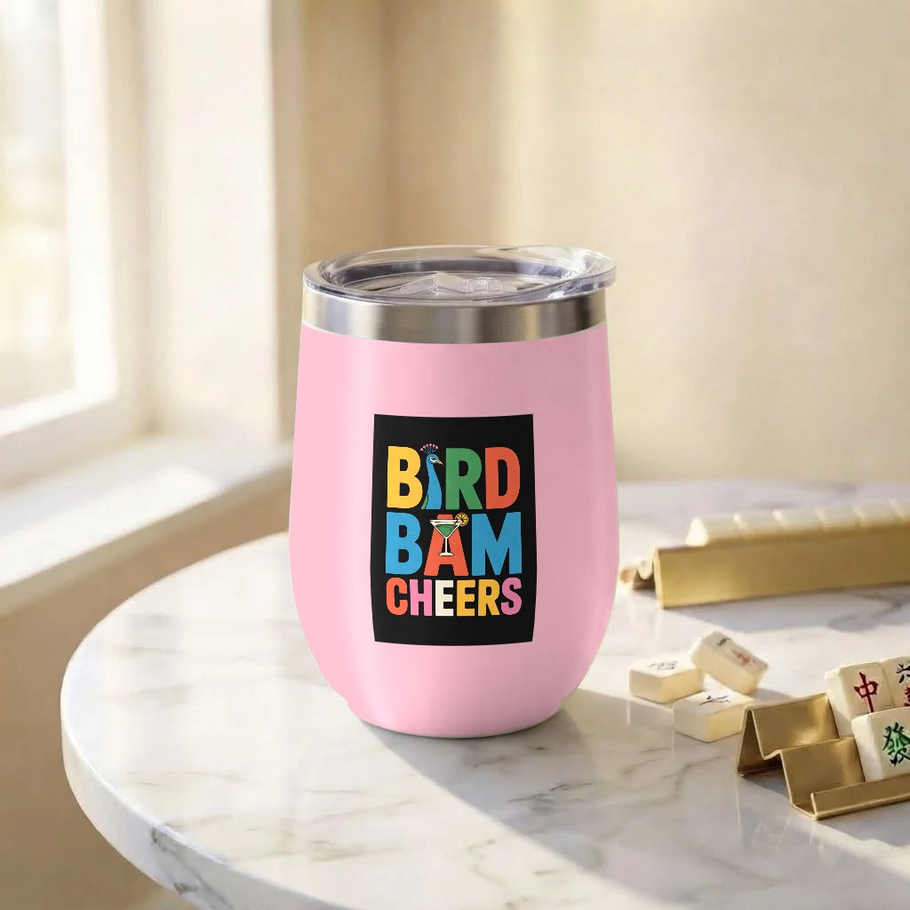 Pink stemless wine tumbler with Bird Bam Cheers printed on the front